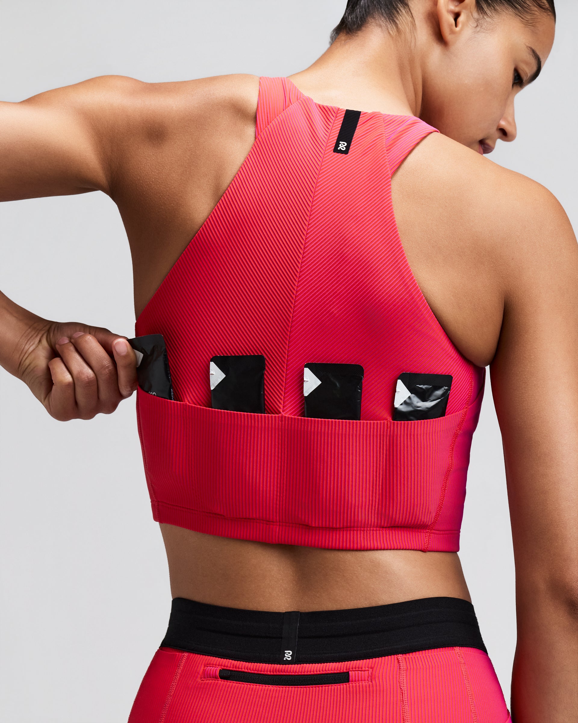 BANDIT RUNNING STRIPED CADENCE ZIP FRONT HALTER CROP