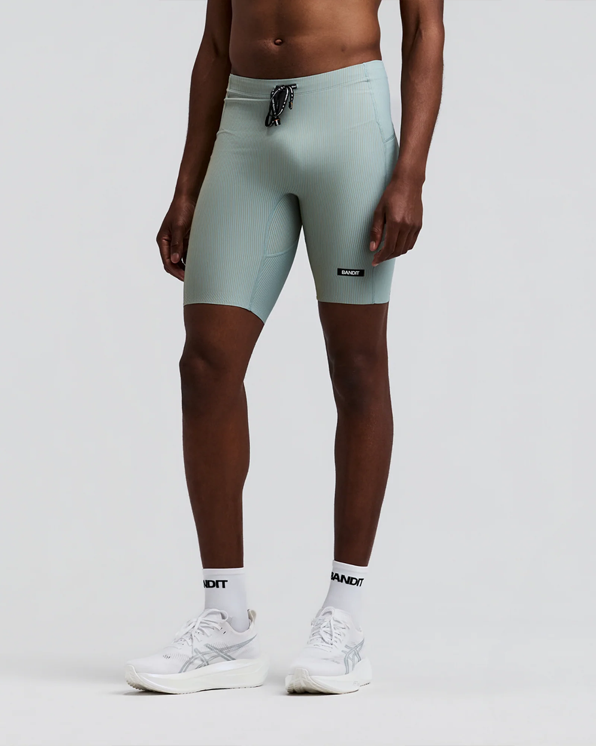 BANDIT RUNNING STRIPED CADENCE™ HALF TIGHTS LAGOON / COPAL