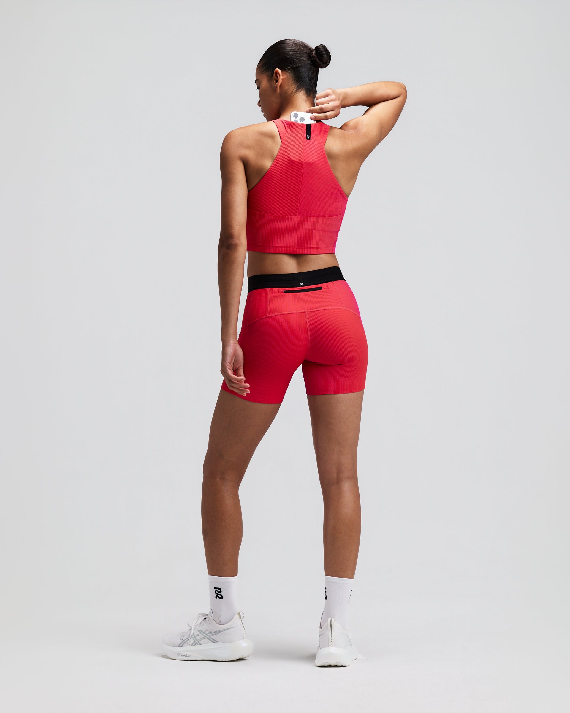 BANDIT RUNNING STRIPED CADENCE ZIP FRONT HALTER CROP