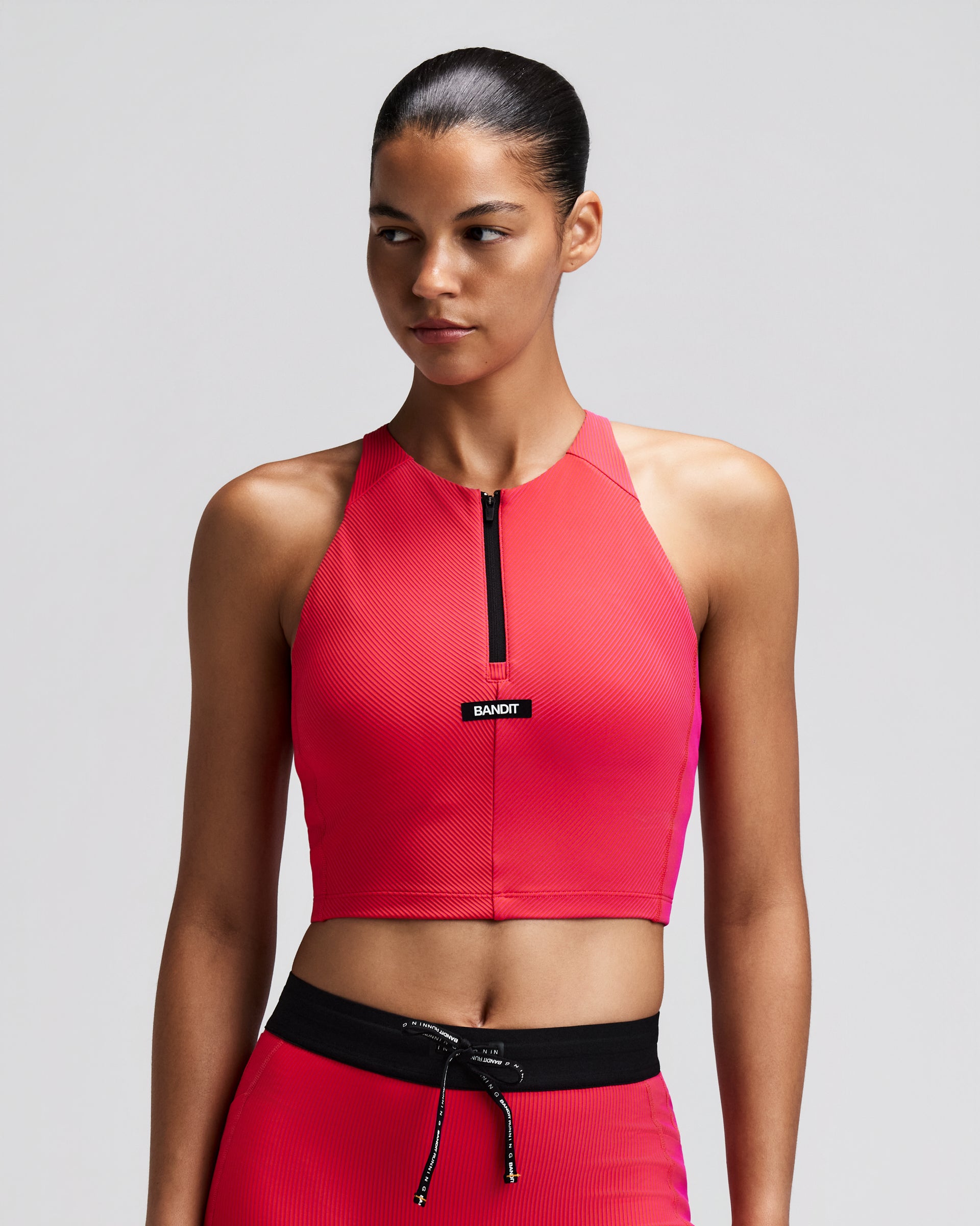 BANDIT RUNNING STRIPED CADENCE ZIP FRONT HALTER CROP