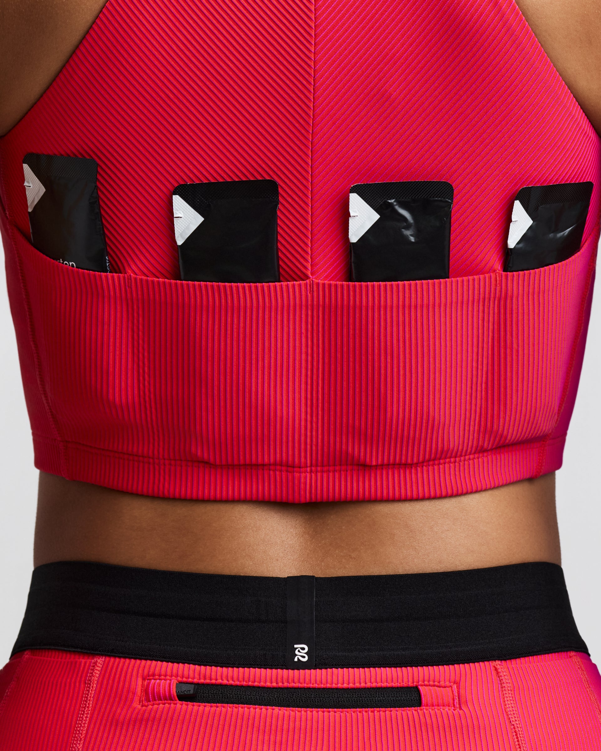 BANDIT RUNNING STRIPED CADENCE ZIP FRONT HALTER CROP